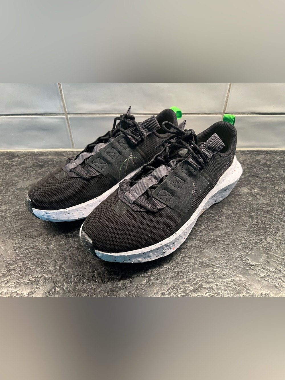 Nike Womens Black Sneakers with Light Blue Speckled Sole and Neon Green Pull Tab